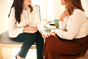 two women talking about urogynecological health issues